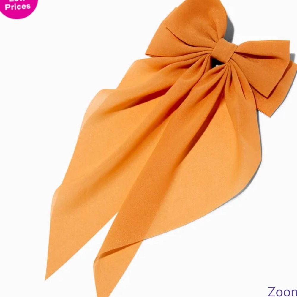 Claire’s peach long tail hair bow clip